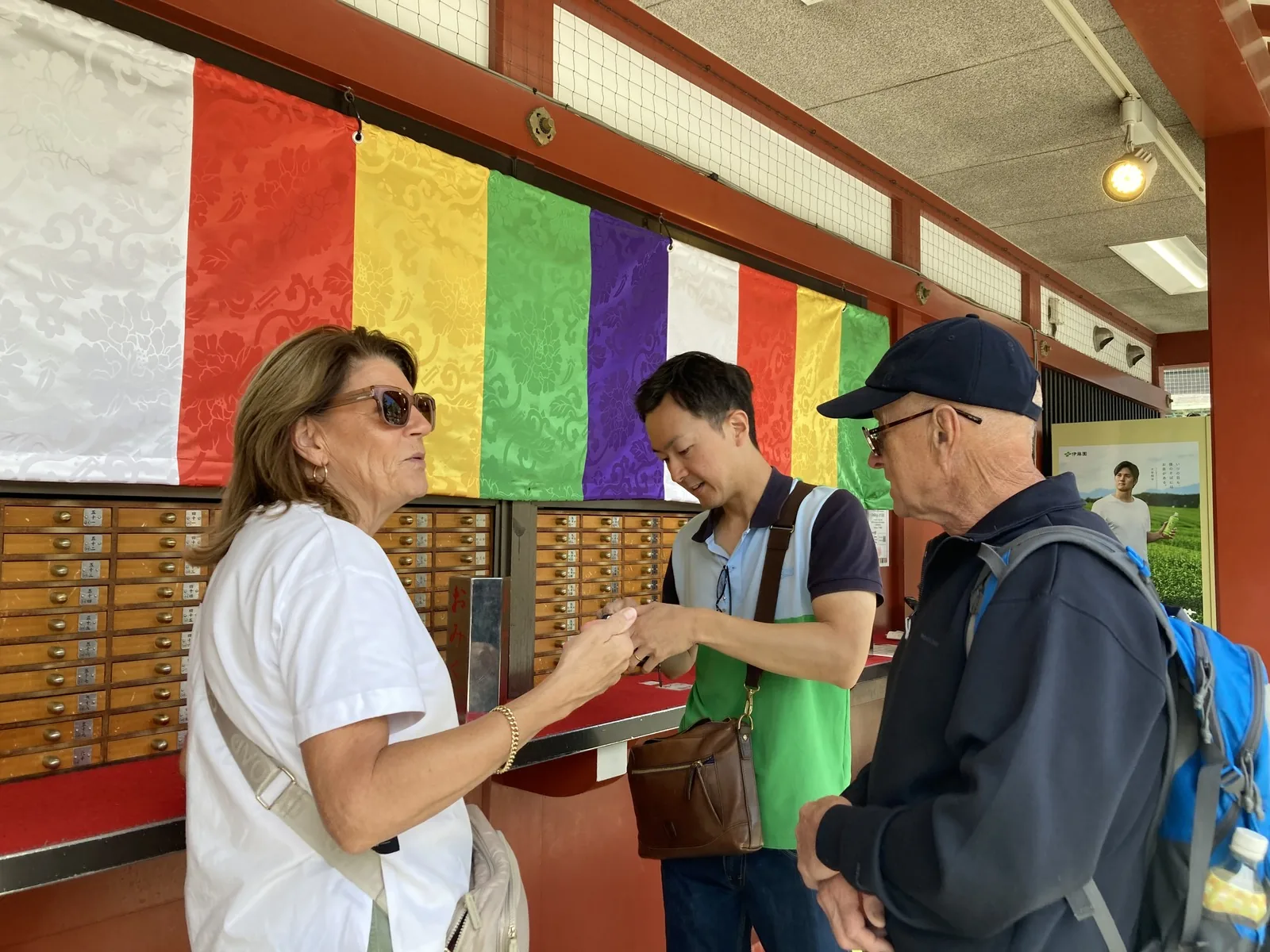 Tour guests drawing omikuji fortune slips at Senso-ji in Asakusa
