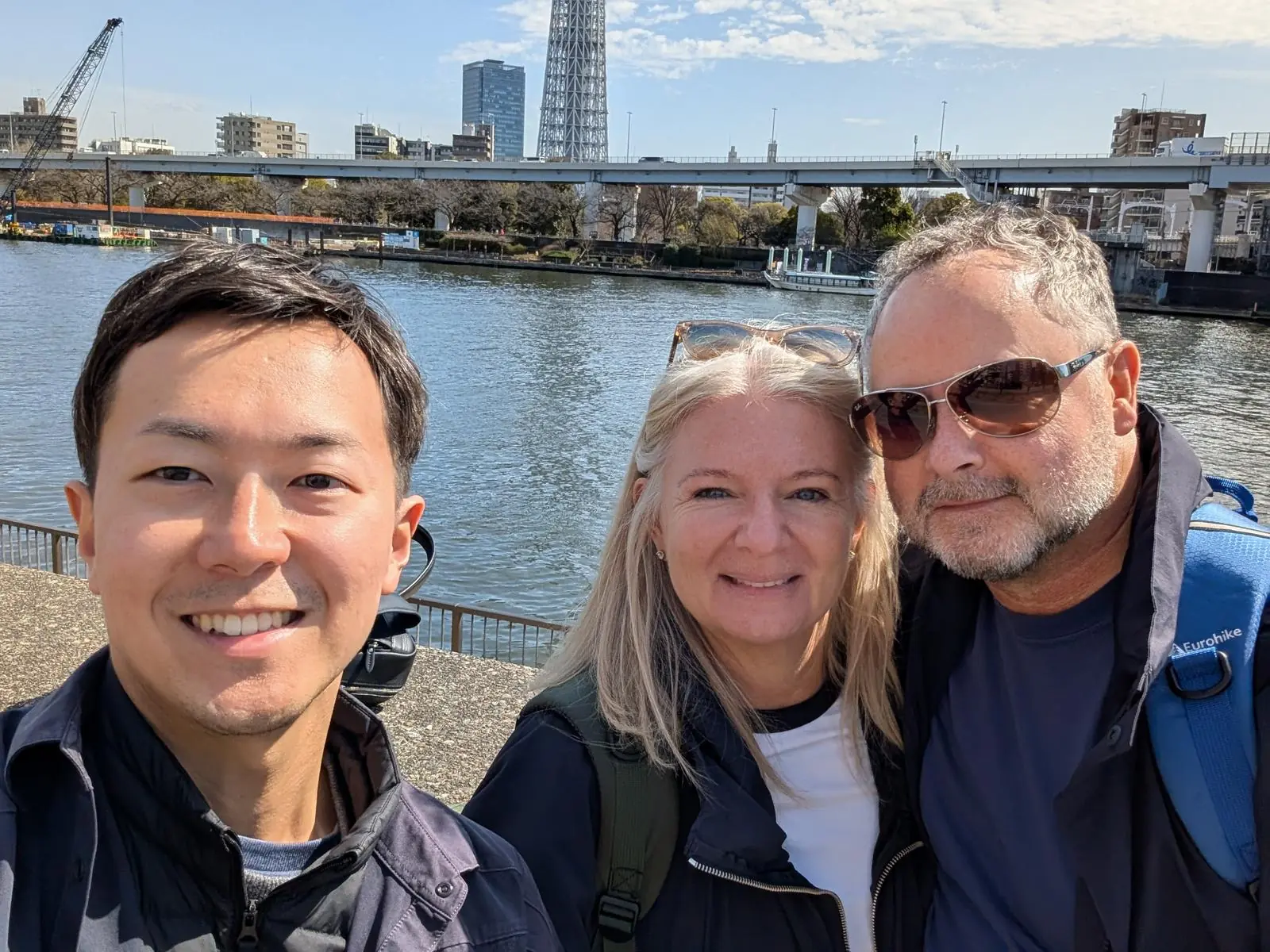 Selfie with guests along the Sumida River with Tokyo Skytree in the background
